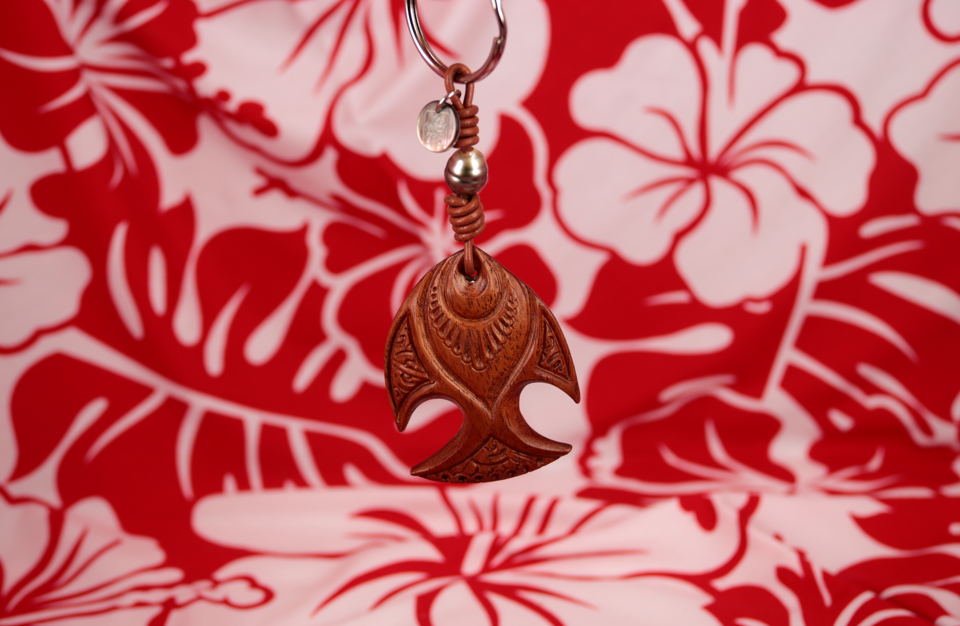 Handmade wooden keychain with maori engraved designs and Tahitian pearl