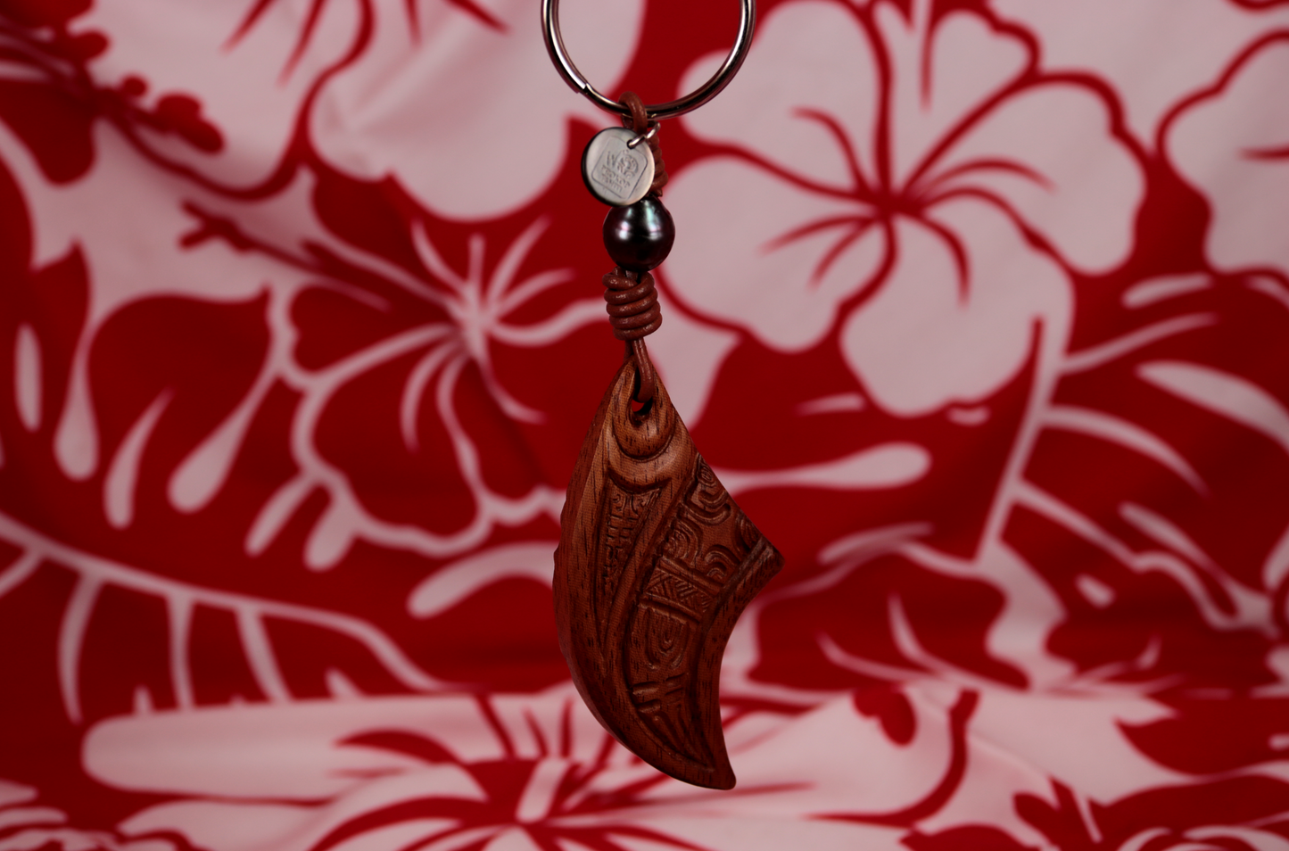 Handmade wooden keychain with maori engraved designs and Tahitian pearl